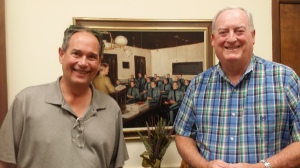 Author W. Thomas McQueeny (right) with Rob Rains in front of a portrait in The Citadel private office of the president.